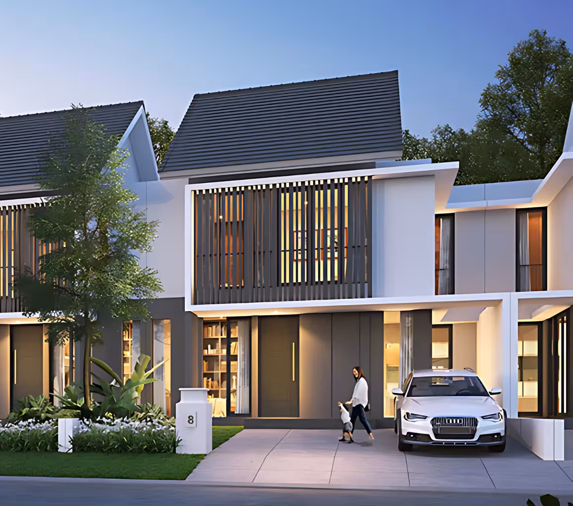 Desain Rumah 2 Lantai dan Biaya Pembangunannya 5 Desain rumah dua lantai bergaya minimalis tropis dengan fasad modern yang didominasi elemen garis vertikal, atap miring, dan kombinasi warna putih serta abu-abu. Rumah ini dilengkapi taman hijau kecil dengan tanaman tropis di bagian depan dan carport yang cukup untuk satu mobil. Jendela besar dengan kisi-kisi kayu memberikan sirkulasi udara dan pencahayaan alami yang optimal. Seorang wanita terlihat berjalan bersama anak kecil di depan rumah, dengan suasana sore hari yang cerah dan tenang.